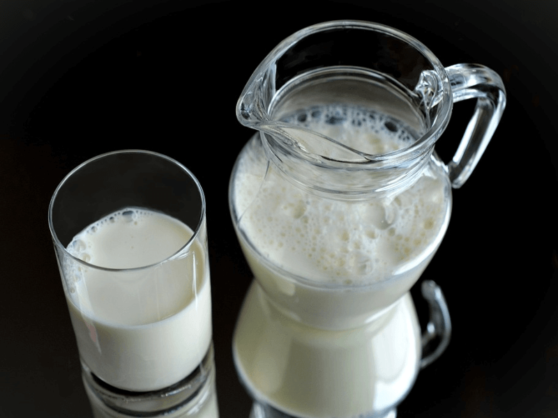 A glass and pitcher of glutamine-rich milk