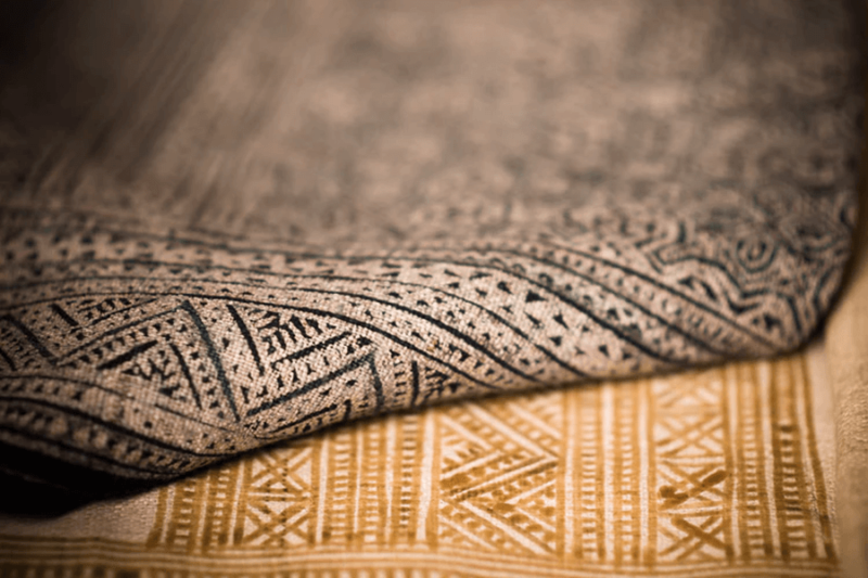 A close up view of patterned rugs