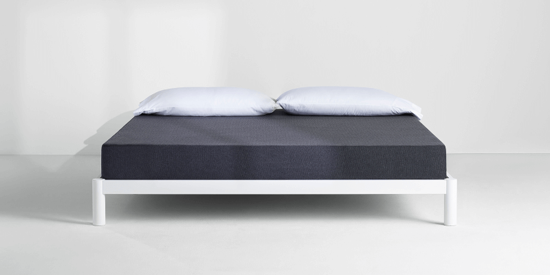 Casper Essential mattress on bed frame with pillows